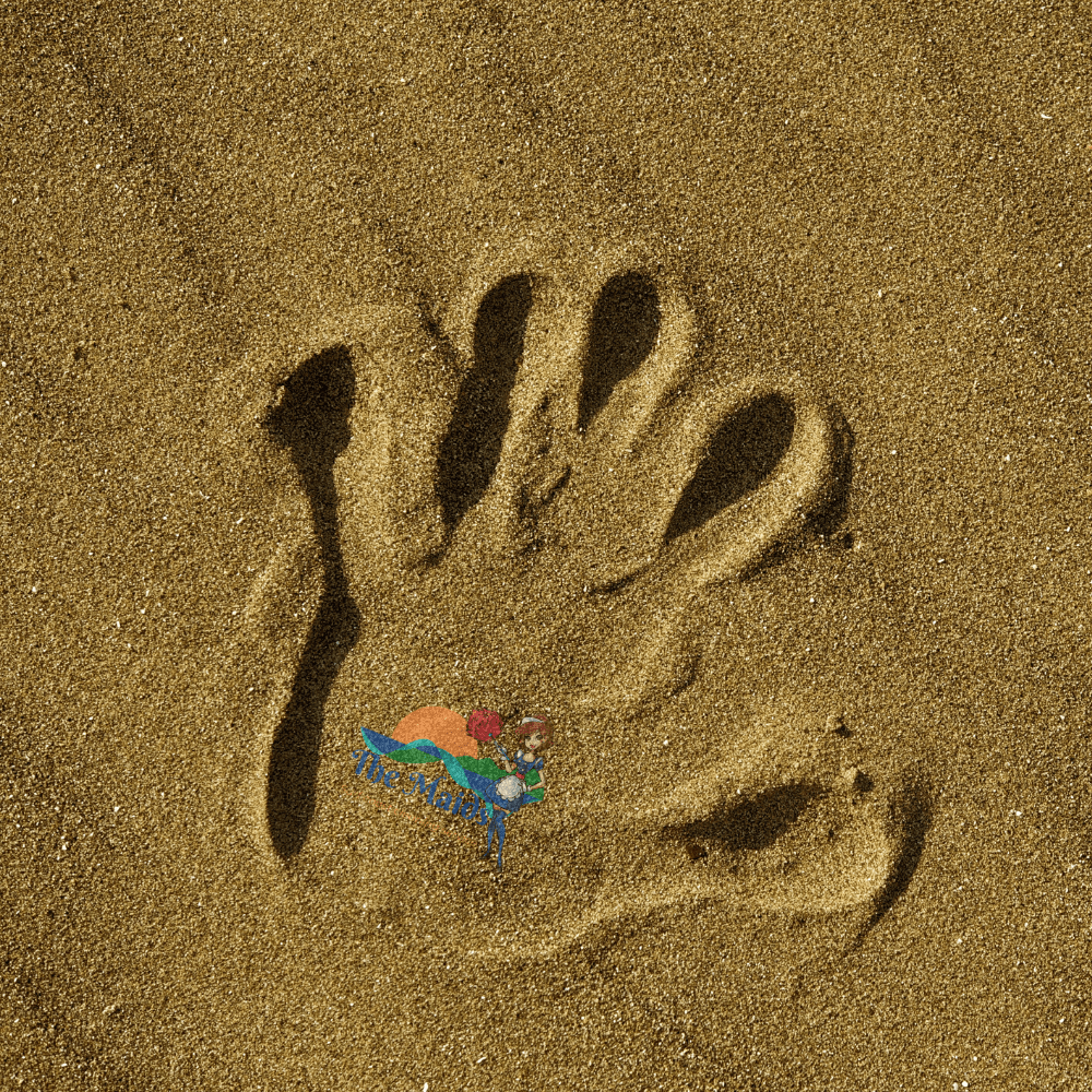 The maids hand in the sand